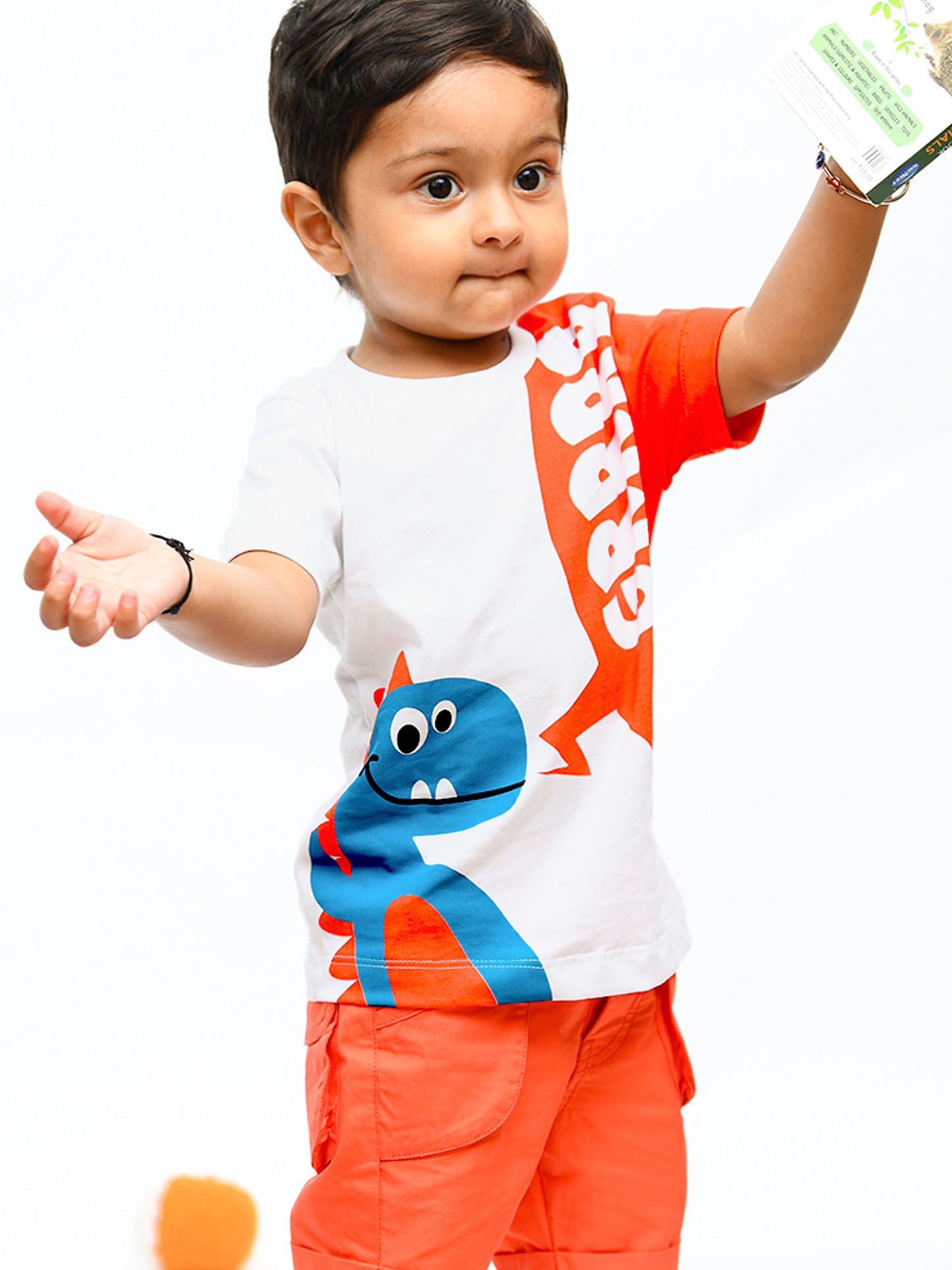 Infant boy wearing a cheerful orange sunshine co-ord set with playful cartoon print – ideal cotton outfit for toddlers in summer