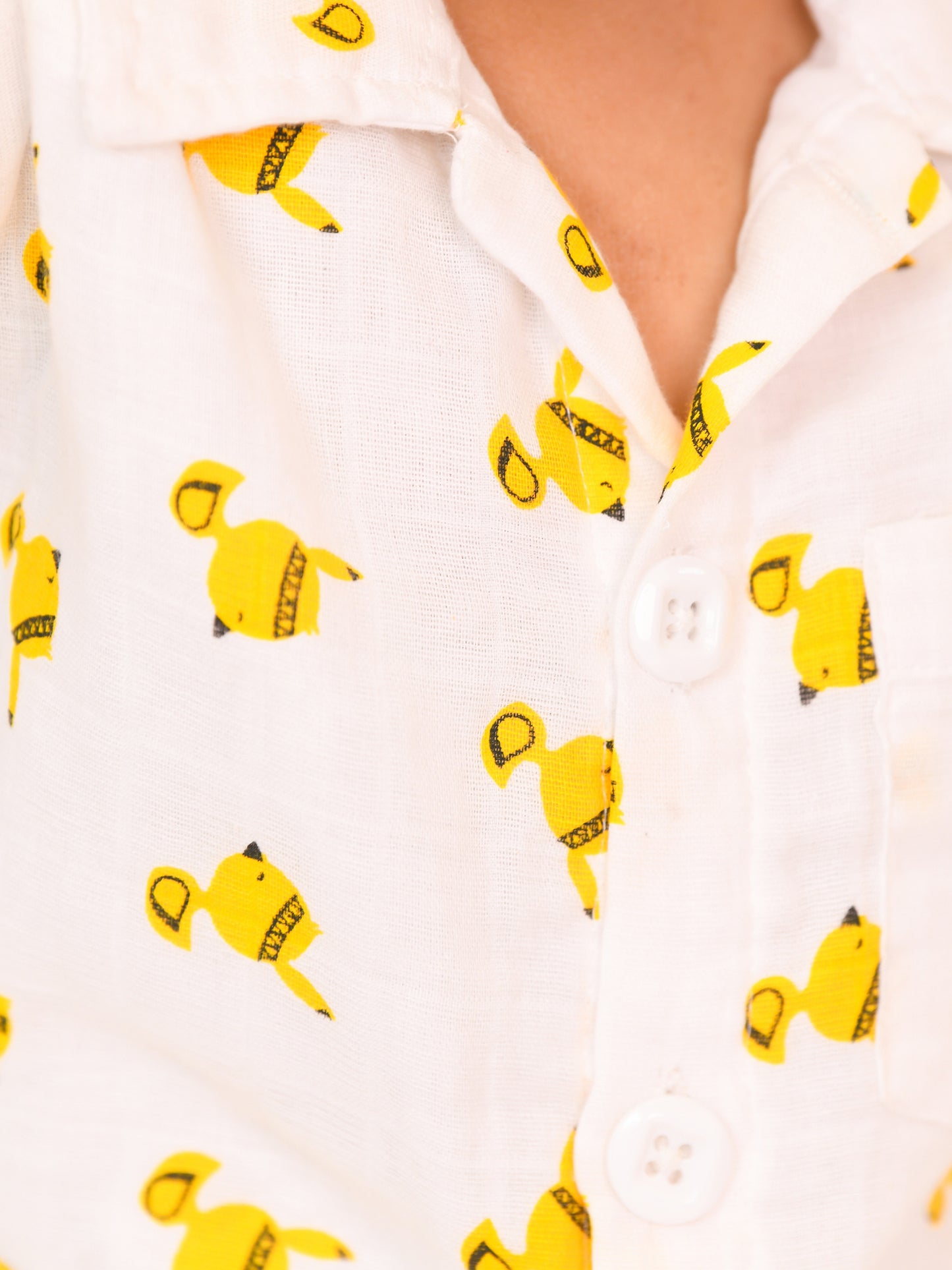 Unisex toddler wearing a soft double gauge cotton co-ord set with playful yellow bird print – comfy everyday outfit