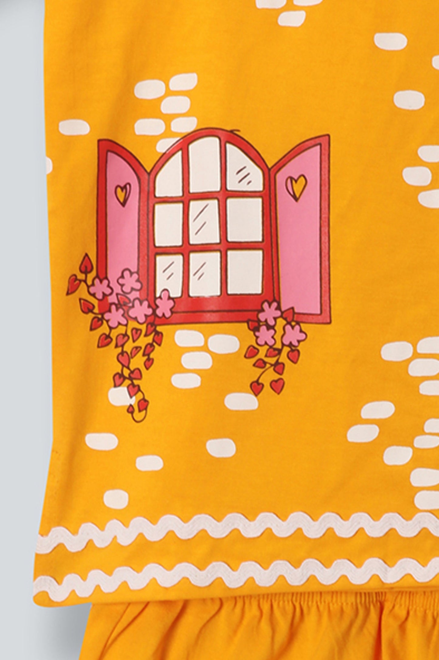 Little Carrot girls yellow printed cotton lounge co-ord set featuring playful house print and scalloped trims