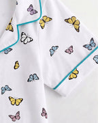 Fabric Detailing Shot of Little Carrot Butterfly Printed Night Suit in white color