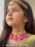 A girls wearing Little Carrot handmade crochet necklace