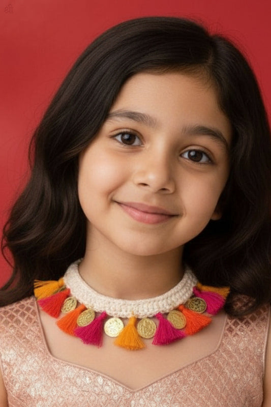 Young girl wearing a colorful Handmade Crochet necklace by Little Caarot, against a red background