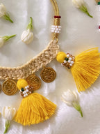 Shoot of Little carrot handmade cotton crochet necklace with tassles and coin detailing