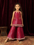 A young girl posing in Little Carrot Kurti Palazzo Set with elephant and ghungroo Detailing