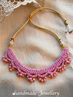 Detailing shoot of Little Carrot Handmade Crochet Lavender necklace