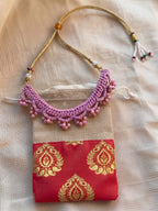 Detailing shoot of Little Carrot Handmade Crochet Lavender necklace