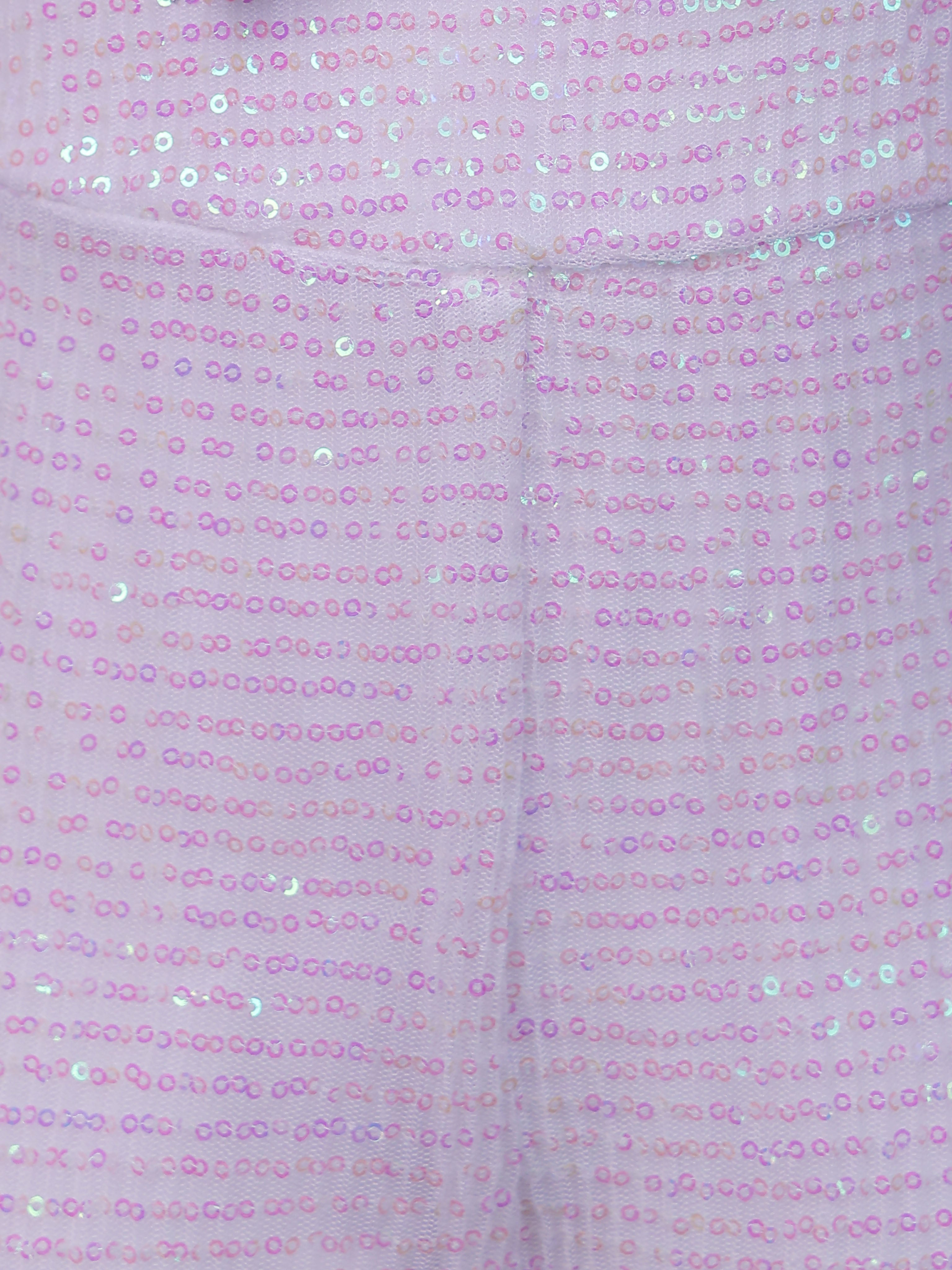 Close-up of a White rainbow sequin fabric with a subtle pattern