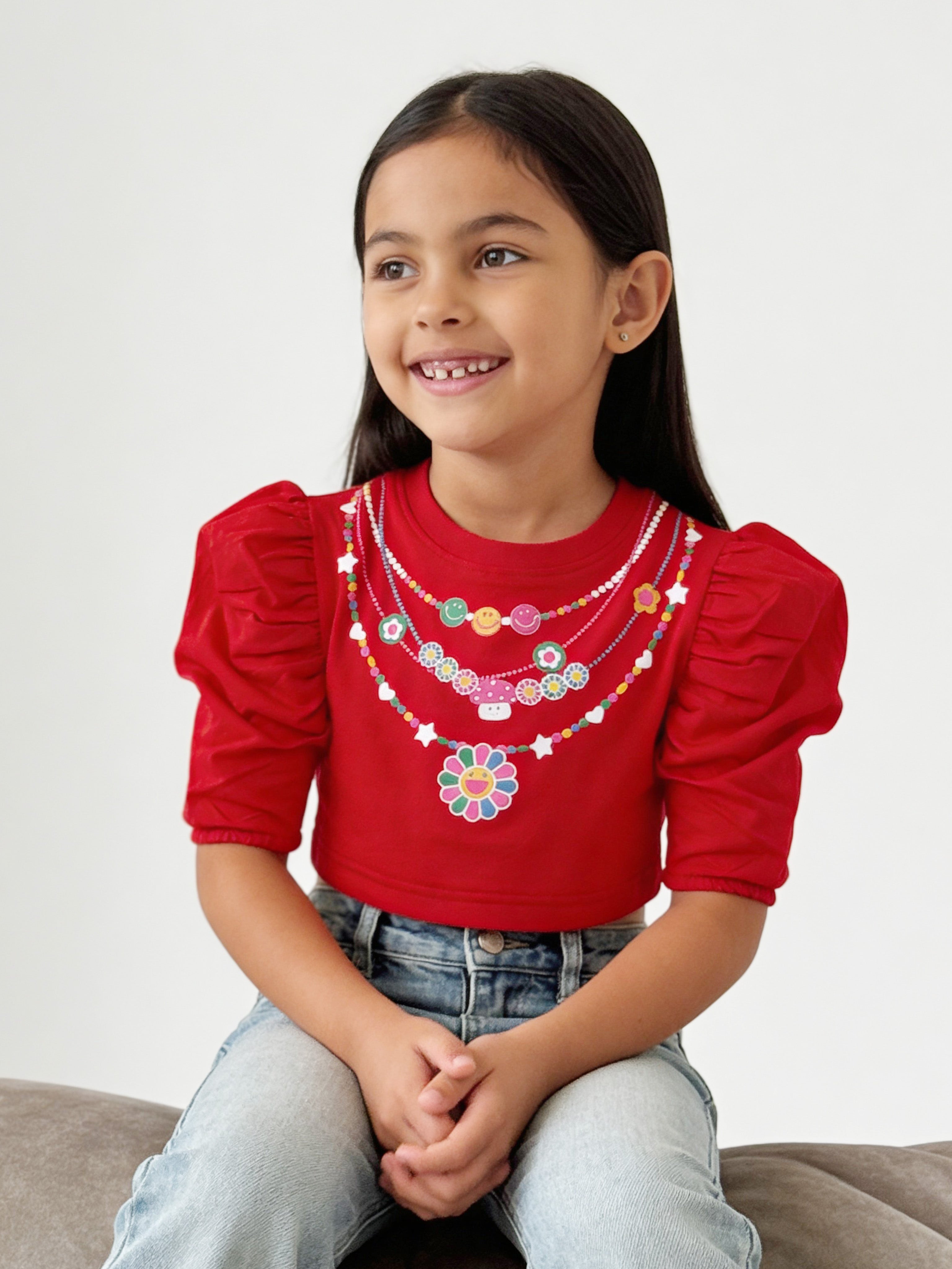 A young Girl wearing Little carrot necklace printed pure cotton crop top