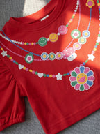 Detailed shot of Little carrot necklace printed pure cotton crop top
