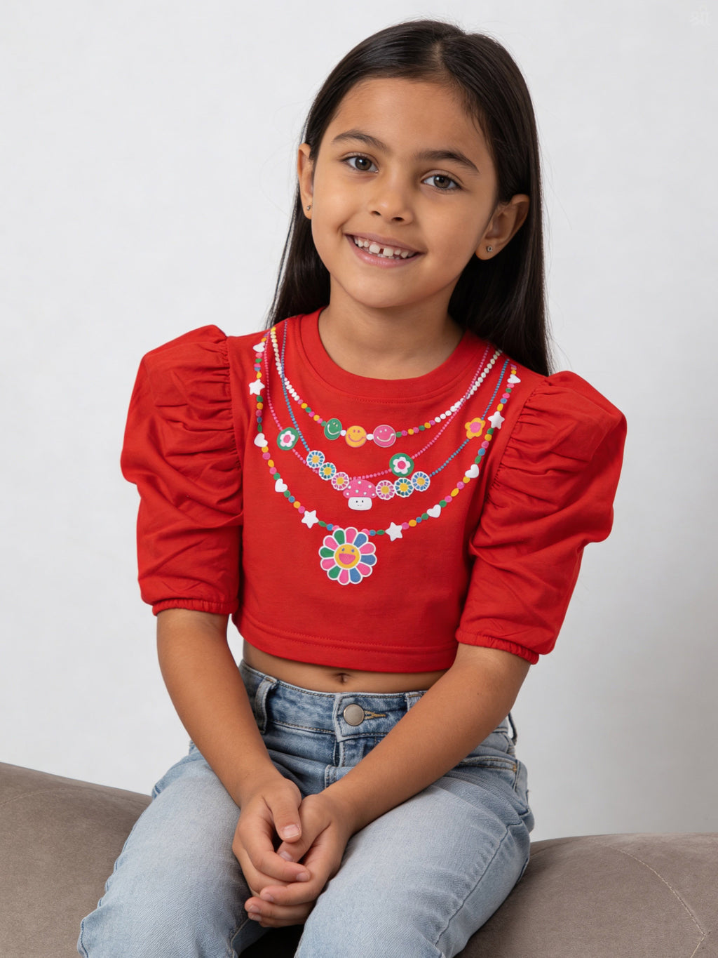 A young girl wearing little carrot necklace printed pure cotton crop top