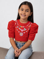 A young girl wearing little carrot necklace printed pure cotton crop top