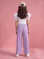 A young girl posing in Little Carrot Heart Printed Glitter Co-ord Set