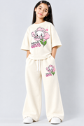A Cute Girl posing in Off White Co-ord Set with cute Kitty Print, A style from Pink Skies Collection by Little Carrot