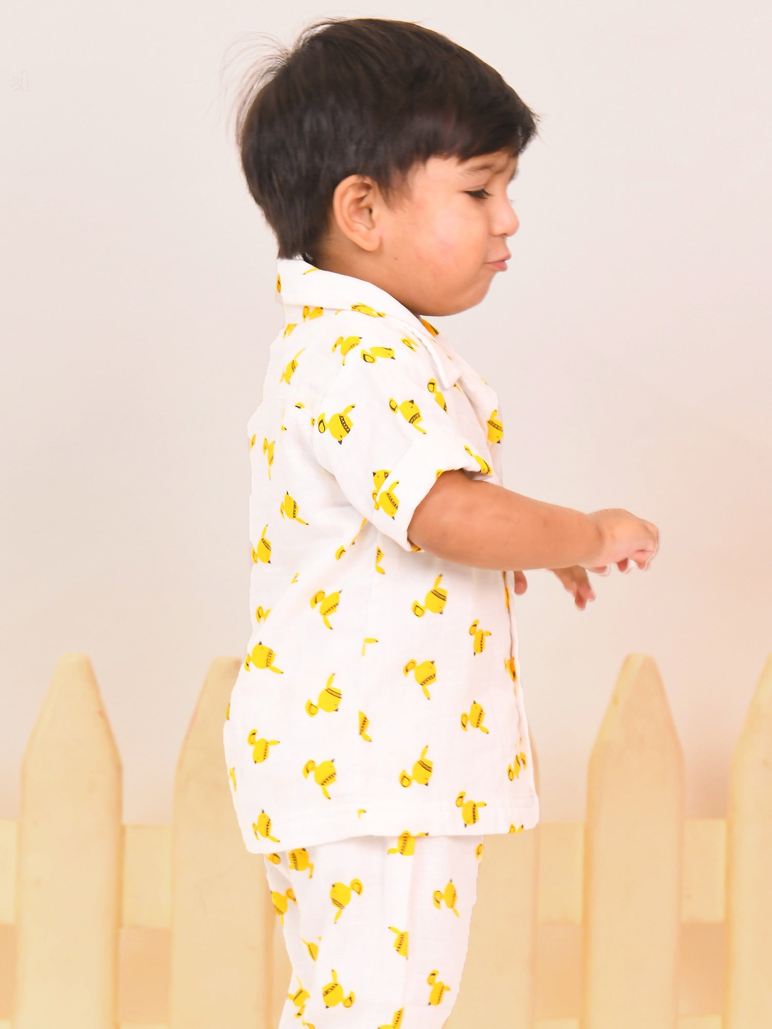 Unisex toddler wearing a soft double gauge cotton co-ord set with playful yellow bird print – comfy everyday outfit