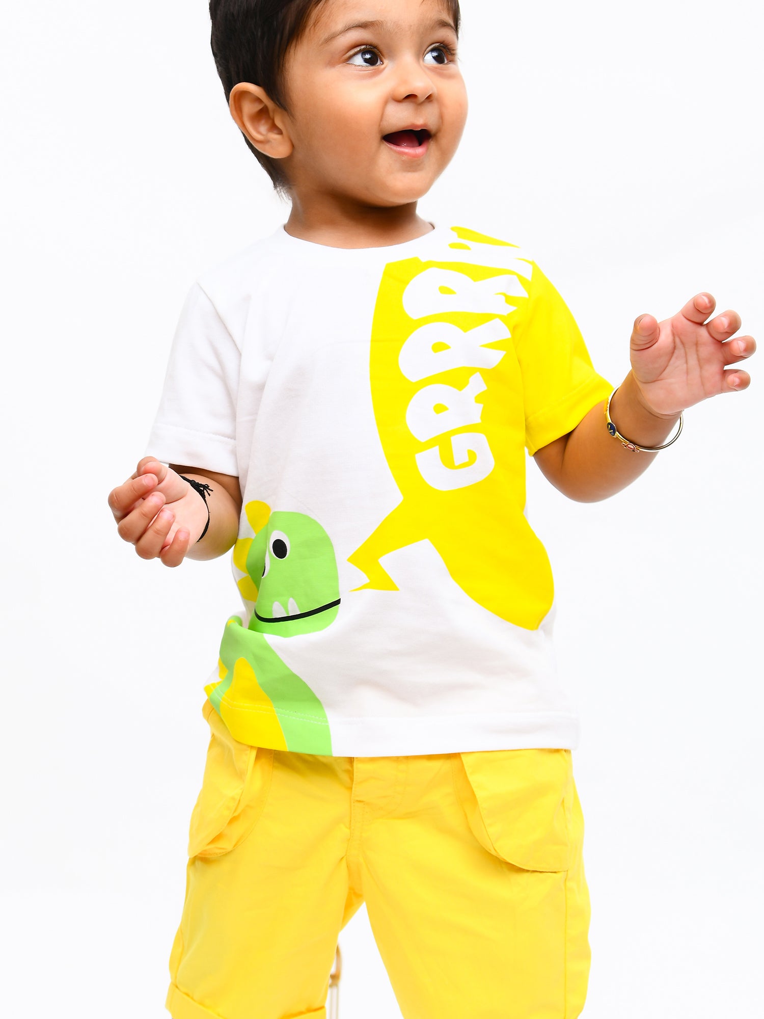 Infant boy wearing a bright yellow sunshine-themed co-ord set with fun cartoon print – perfect cotton outfit for playful summer days