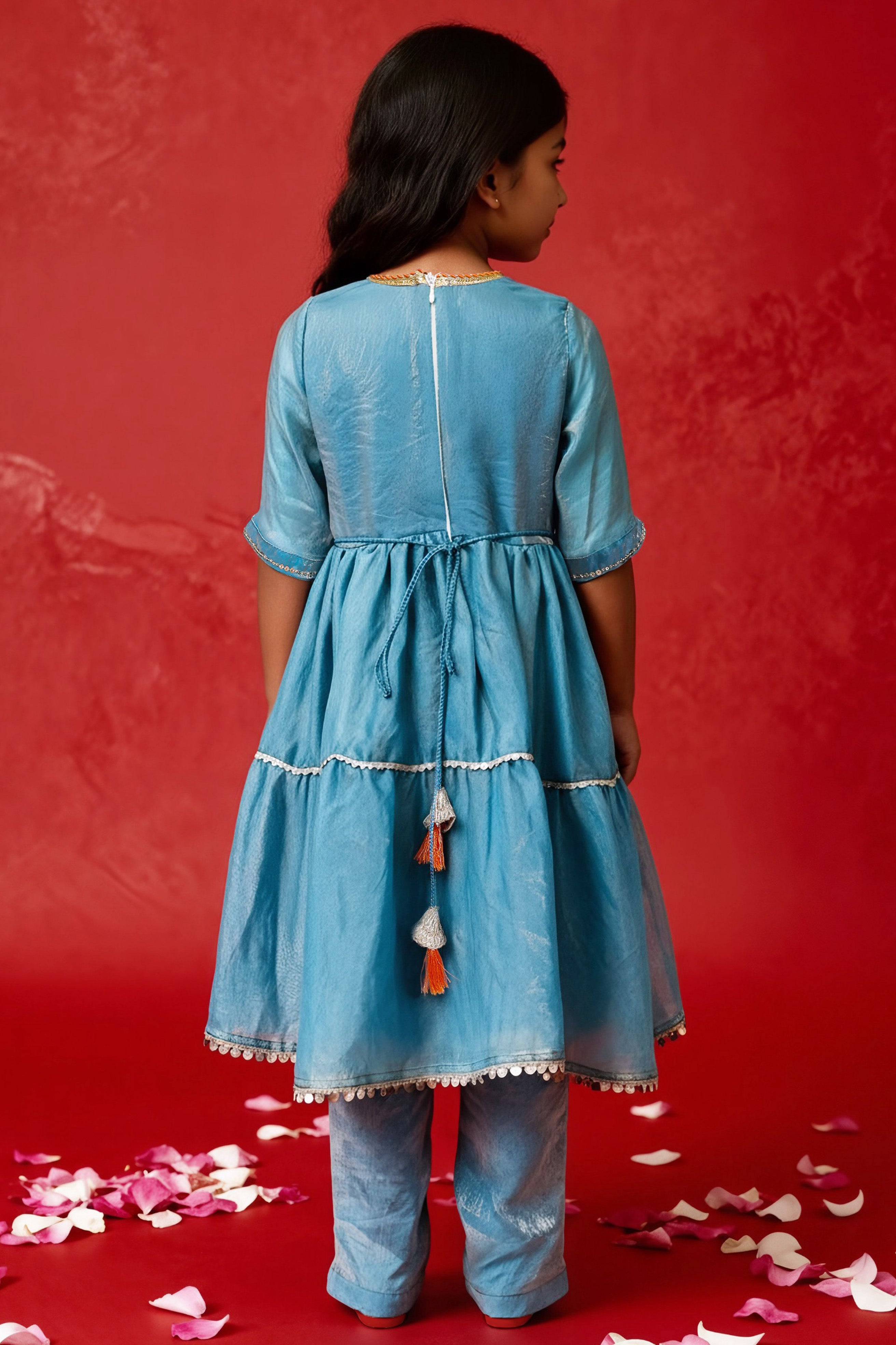 Girl wearing blue Anarkali kurta set with sequins, cord work, lace detailing, straight pants and dupatta by Little Carrot.