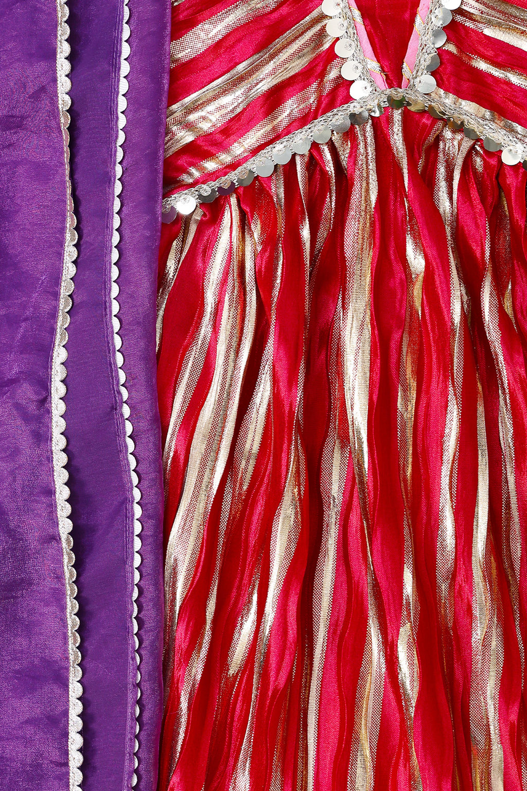 Close-up of a red and gold fabric with purple border
