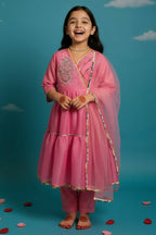 Girl wearing pink Anarkali kurta set with sequins, cord work, lace detailing, straight pants and dupatta by Little Carrot.