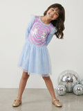 A young happy girl is posing in Little Carrot Blue Unicorn Dress