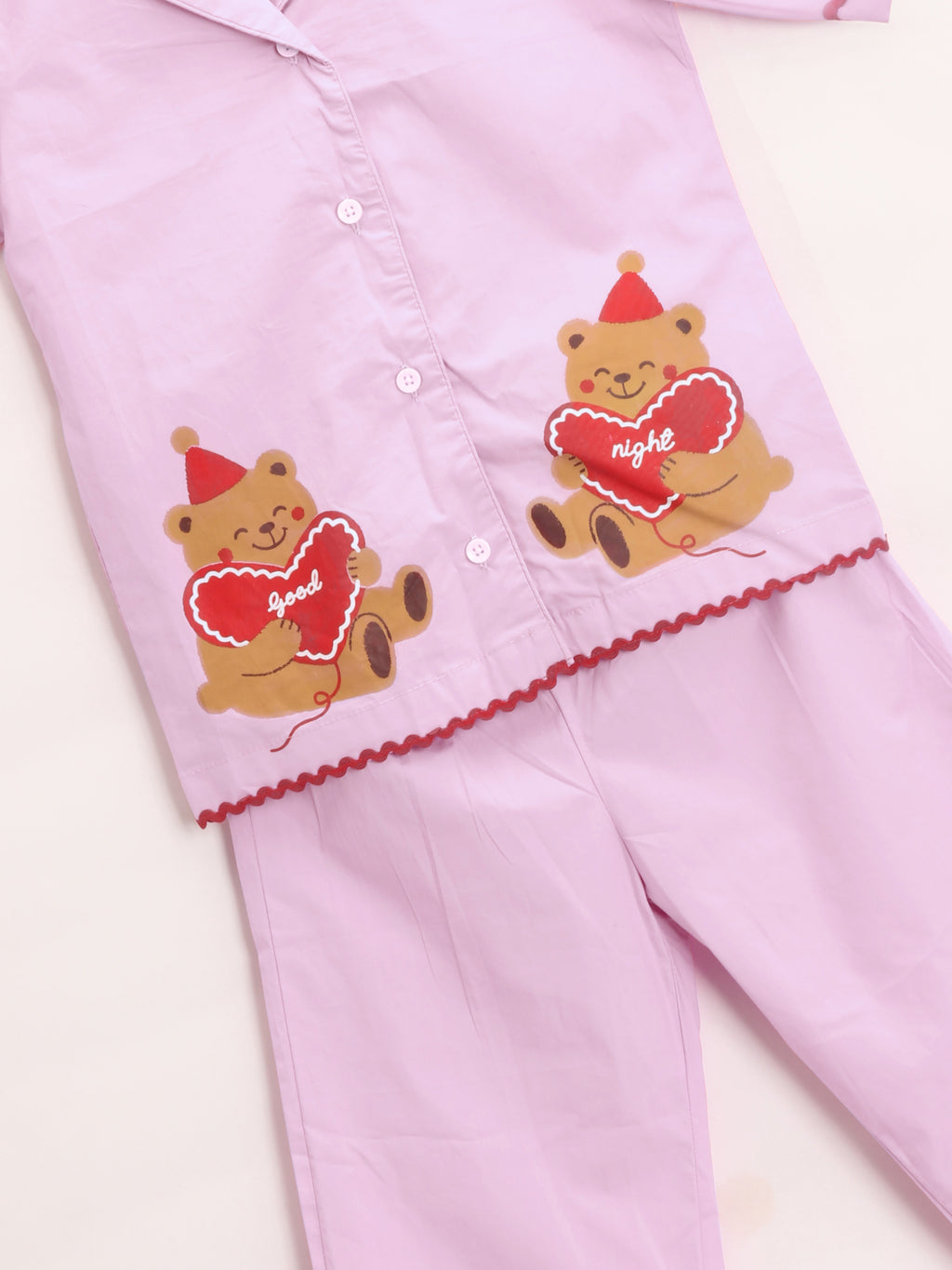 Pink Girl's pajama night suit set with teddy bear designs on a white background